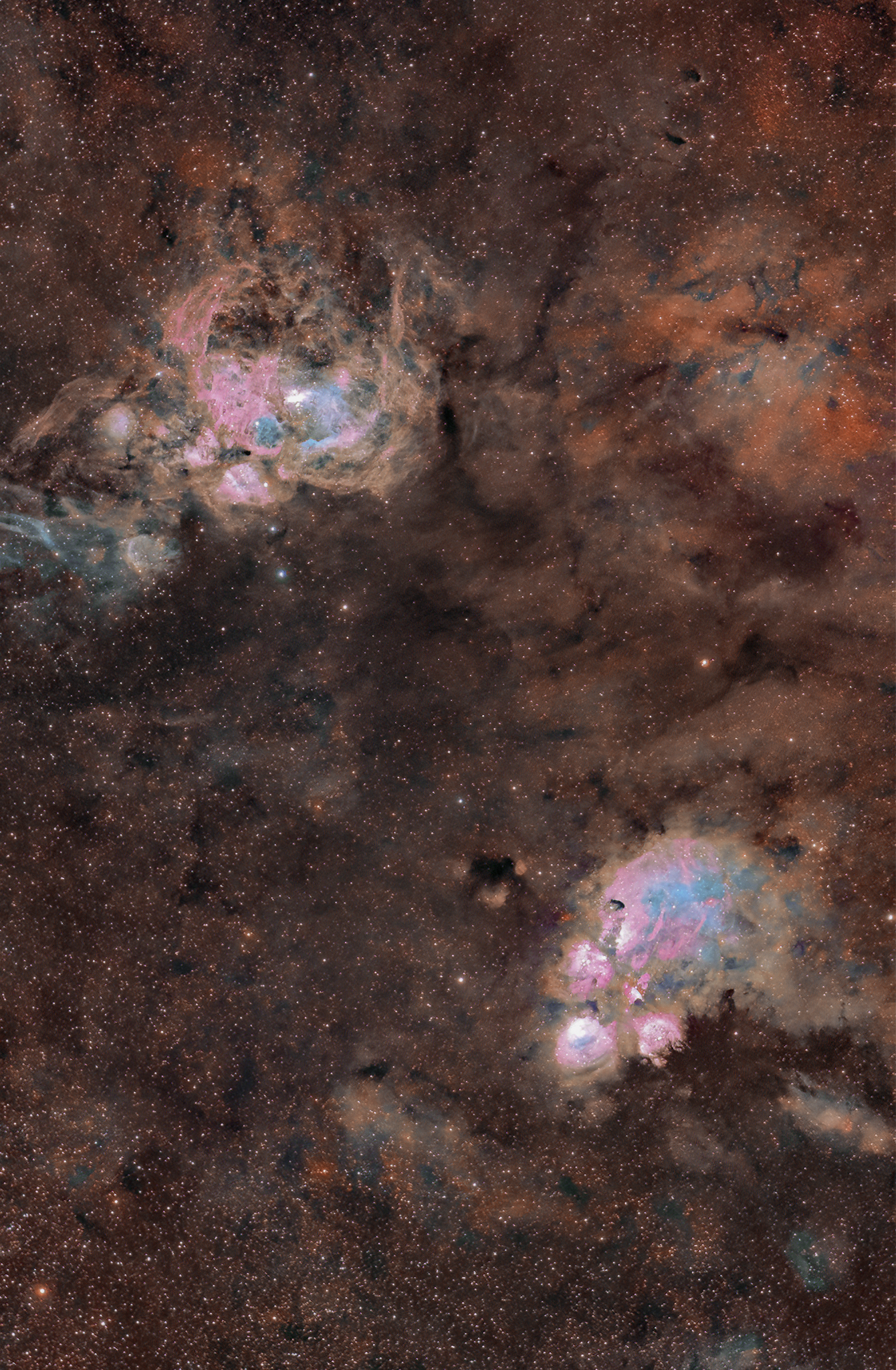 The Cat's Paw (lower) and Lobster nebulae